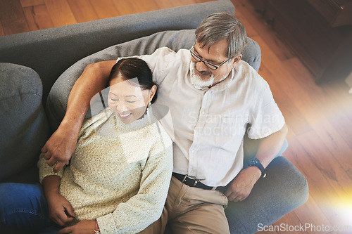 Image of Relax, love and senior couple on a sofa hugging, bonding and laying together in the living room. Happy, smile and elderly man and woman in retirement resting on a weekend in the lounge at modern home
