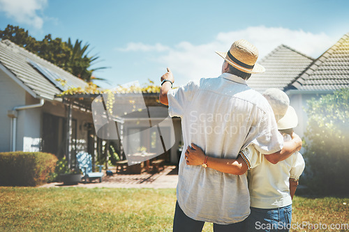 Image of Back view, couple and pointing outdoor at new home, real estate or house investment. Man, woman and hug at front of property for moving together in building, dream neighborhood and mortgage at garden