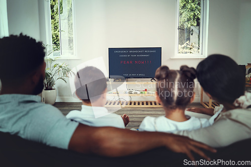 Image of Back, family and watching tv for government announcement with people in their home during an emergency broadcast. Mother, father and children in the living room for fear propaganda in a disaster