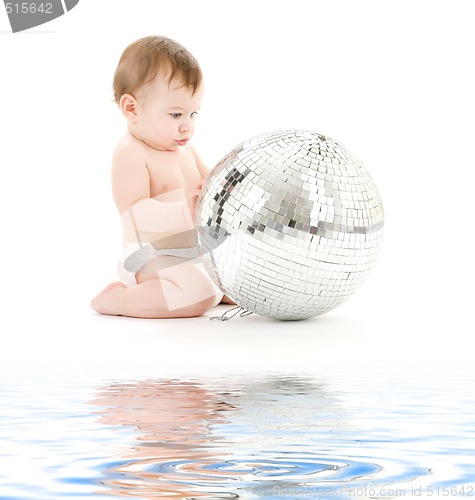 Image of adorable baby boy with big disco ball