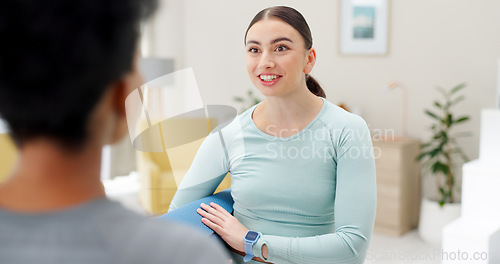 Image of Friends, yoga and women in conversation in home for wellness, healthy body and fitness. Health club, living room and happy people talking with gym mat for pilates, exercise support and mindfulness