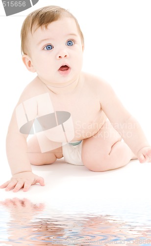 Image of crawling baby boy in diaper