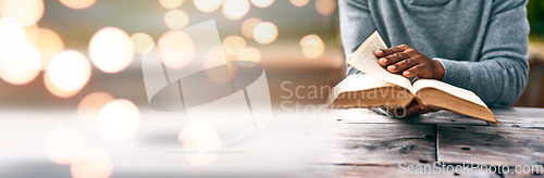 Image of Banner, hands and person reading book on space, mockup and bokeh table for bible study, religion and spiritual education. Novel, literature and information for research, prayer and gospel learning