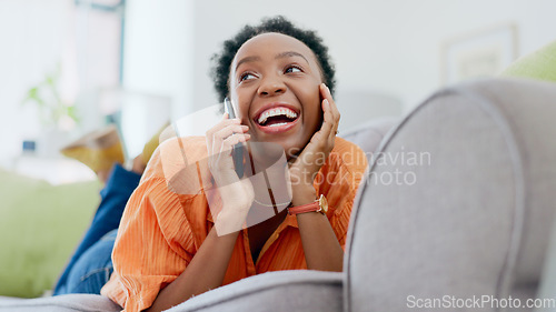 Image of Relax, phone call or happy black woman on couch in communication in house living room. Smile, mobile contact or excited African lady talking or speaking of gossip in discussion or connection on sofa