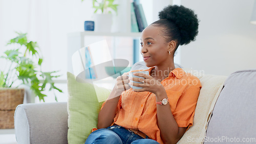 Image of Black woman, smiling and sofa with hot beverage, relaxing and house for self care, lounge and break. Me time, comfort and quality time in home, lounge and day off for resting, laughing and happiness