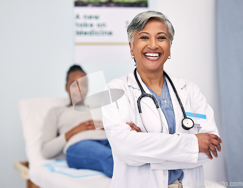 Image of Happy senior woman, portrait and doctor with arms crossed for professional healthcare at hospital. Mature female person, nurse or medical surgeon smile with patient for checkup appointment at clinic