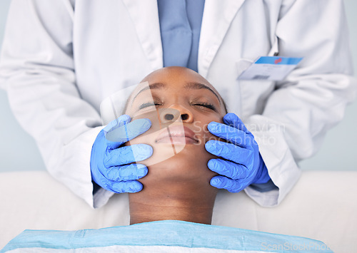 Image of Massage, hands and a skin analysis on a black woman from a doctor for healthcare or dermatology. Spa, wellness and an African patiennt with a facial rub from a medical employee for a cleaning