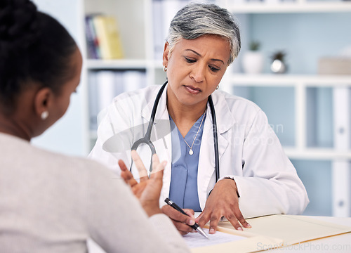 Image of Senior doctor, patient and writing prescription, diagnosis or notes for checkup, results or consultation at hospital. Mature female person, medical or healthcare filling paperwork or life insurance