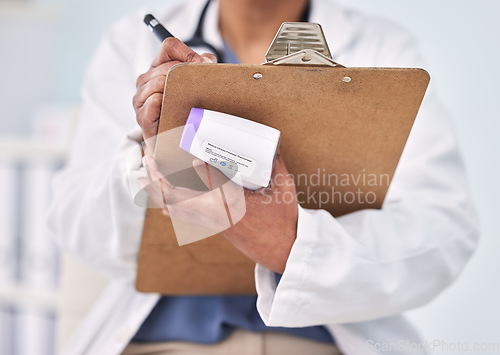 Image of Person, doctor and writing on clipboard for prescription, diagnosis or results with thermometer at hospital. Closeup of medical nurse or surgeon taking notes, temperature or appointment at clinic