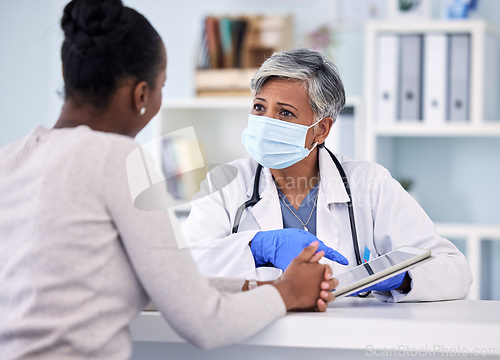 Image of Senior woman, doctor and tablet with patient in consultation, checkup or diagnosis with mask at hospital. Mature female person, medical nurse or surgeon consulting customer with technology at clinic