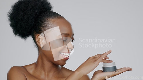 Image of Woman, face and hands with moisturizer for cosmetic, beautiful skin and happiness in facial, spa and studio background. Black model, glow and dermatology for self care, spf cream or aesthetic mockup