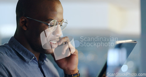 Image of Man, phone call and tablet for reading in office, investing agency or night for deal, networking or fintech. African trader, touchscreen and black business owner for research, ideas or stock market