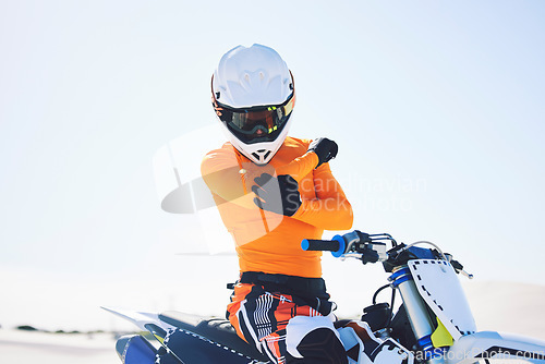 Image of Moto, person or rider with injury on bike in desert for sports on holiday, vacation or trip in Namibia. Driver, elbow and pain with activity, fearless or fast for fun in summer with, people or race