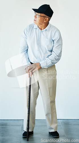 Image of Mature, person and walking stick while thinking with health, recovery and rehabilitation for assistance. Elderly, man or grandfather at medical office for doctor appointment, diagnosis or results