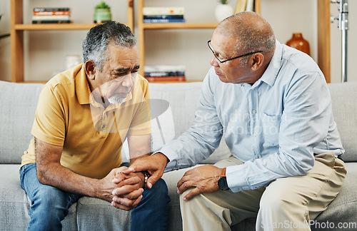Image of Men, sofa and support with friends in communication, hand gesture and grief with pain or loneliness. Elderly men, diversity and conversation on mental health or emotional counselling on sad with loss