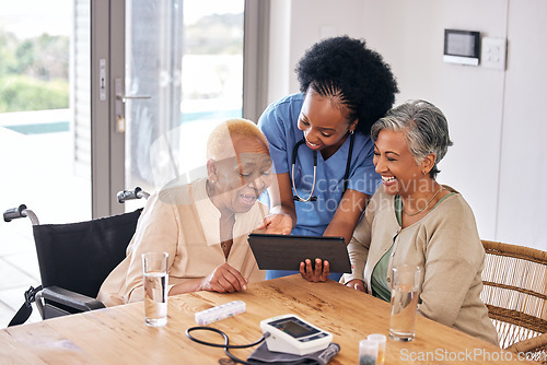 Image of Tablet, smile and an assisted living caregiver with old women in the kitchen of a retirement home for consulting. Blood pressure, medical and an african nurse showing information to patient friends