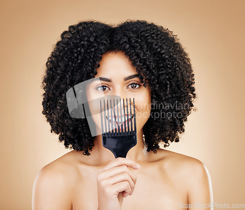 Image of Hair, comb and portrait of woman with afro for style isolated in a studio brown background for wellness and skincare. Texture, natural and young person with cosmetic aesthetic in Brazil hairdresser