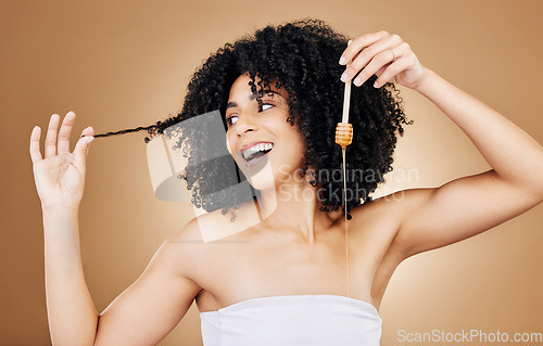 Image of Honey, hair and beauty portrait of woman with natural, care and oil treatment on studio background with happiness. Happy, African haircare and product with honeycomb moisture and sugar benefits