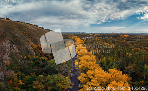 Image of Aerial view of road in beautiful autumn Altai forest