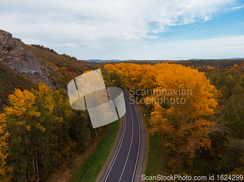 Image of Aerial view of road in beautiful autumn Altai forest