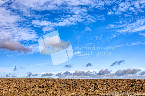 Image of autumn field with sky with clouds