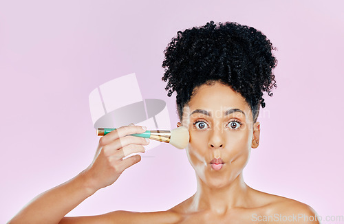 Image of Woman, brush for makeup and kiss, face and beauty with foundation isolated on pink background. Model with surprise, cosmetic tools and portrait, pouty lips and natural with powder in a studio