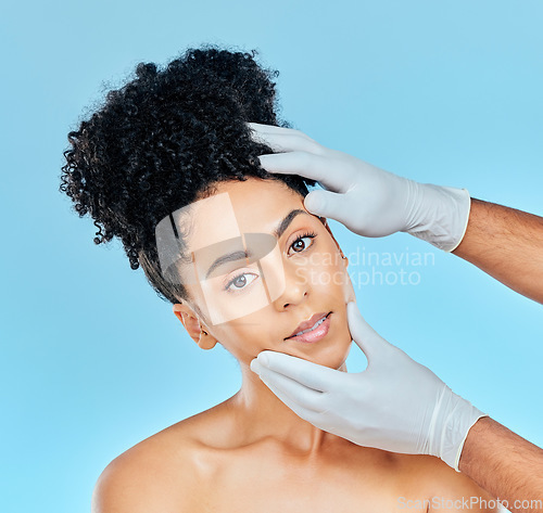 Image of Facial, plastic surgery and portrait of woman with hands on face in studio for cosmetic beauty consultation. Skincare, dermatology and professional collagen therapy, face of model on blue background.