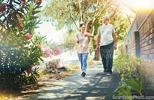 Image of Street, neighborhood and senior couple walking as fitness , exercise and outdoor workout together as wellness. Health, time and calm elderly people on retirement training muscle or sport freedom