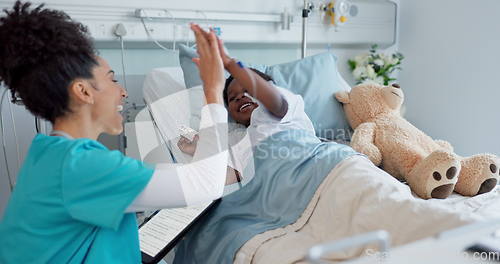 Image of Happy woman, doctor and high five with child patient for success, teamwork or good job on hospital bed. Friendly female person or medical nurse touching hands of little boy smile in support at clinic