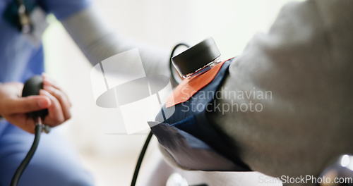 Image of Blood pressure, consulting and closeup of nurse with arm of patient for medical care, wellness and service. Healthcare, hospital and doctor with heart rate machine on patient for cardiology support