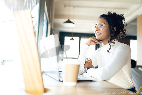 Image of Laptop, cafe and remote work with a digital marketing woman in a restaurant for research. Computer, small business and a young freelance employee in a coffee shop or restaurant as a startup worker