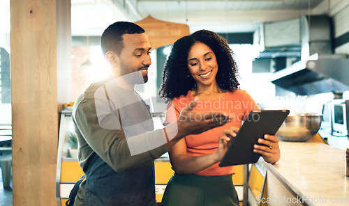 Image of Coffee shop, talking and man with a woman and tablet for online orders, retail information and advice. Happy, ecommerce and a business owner with a waiter and technology reading review on the web