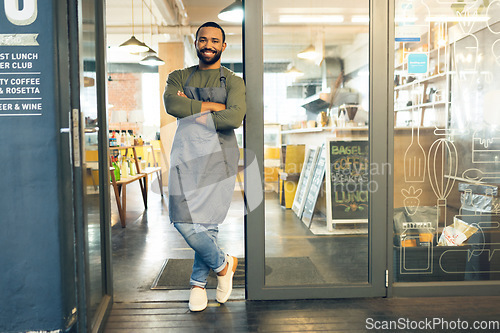 Image of Happy man, portrait and small business owner on door of cafe with arms crossed in confidence or retail management. Male person, barista or waiter smile by entrance of coffee shop or ready for service