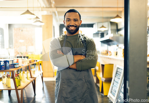 Image of Happy man, portrait and small business owner of cafe with arms crossed in confidence or retail management. Male person, barista or waiter smile by entrance of coffee shop, store or ready for service