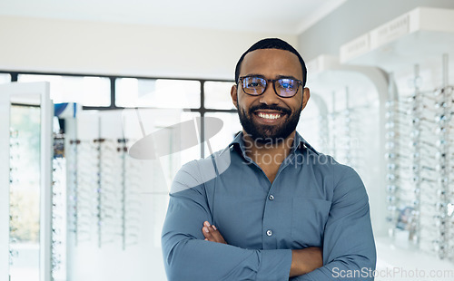 Image of Eyeglasses, arms crossed and portrait of happy man, optician or ophthalmologist for vision help, healthcare or ophthalmology. Lens glasses, pride and professional African ophthalmologist for eye care