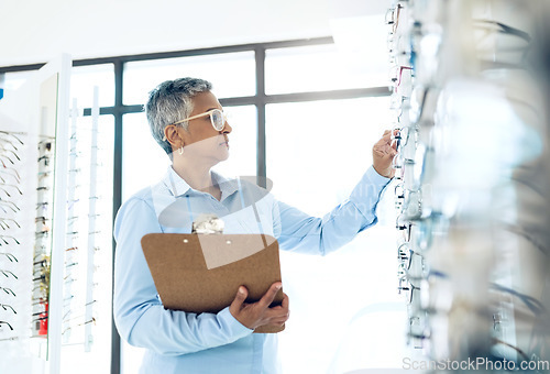 Image of Glasses, eye care or woman with checklist in store for retail stock, inventory management or eyewear. Vision, ophthalmology or senior optician in frame clinic for optometry or product quality control