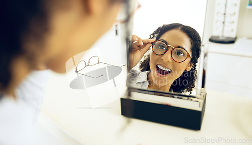 Image of Optometry store, mirror and woman surprise over eyeglasses decision, optical clinic product or prescription eyewear. Face reflection, ocular eye care and customer shocked, wow and excited for glasses