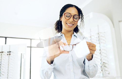 Image of Optometry, woman is cleaning glasses with fabric and hygiene, vision and eye care with health and wellness. Eyewear, maintenance and wipe away dust with microfiber cloth at clinic and frame with lens