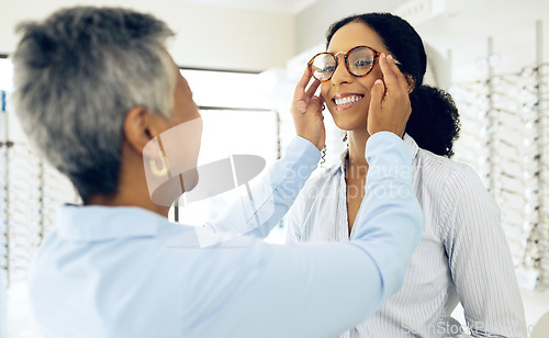 Image of Optometry, consulting and women with glasses for decision, choice and eye care option in optician store. Healthcare, ophthalmology and people in clinic for prescription lens, spectacles and frames