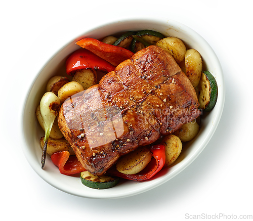 Image of whole roast pork and vegetables