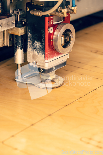 Image of Laser cutting wood.