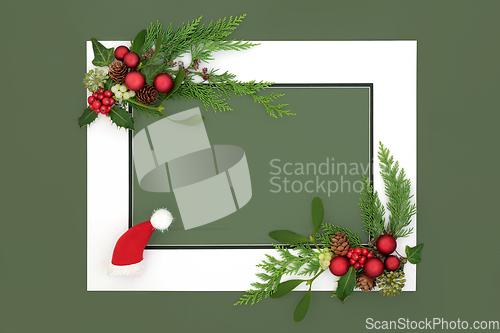 Image of Christmas Eve Background Border with Santa Hat Baubles and Flora