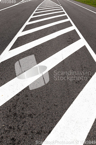 Image of white road markings drawn