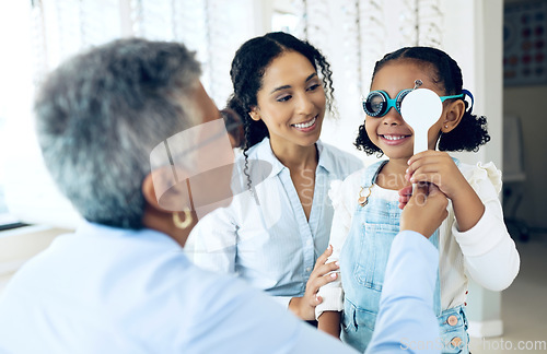 Image of Eye, test and child with mother at optometrist for eyesight exam, vision and glasses as medical optic health. Care, eyewear and doctor help parent or mom with kid as optometry diagnosis for lenses