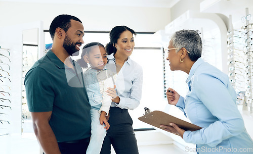 Image of Family, optometry and eye care with a woman optometrist in a clinic to see a patient for vision assessment. Mother, father and daughter at the optician for an appointment to test eyesight for kids