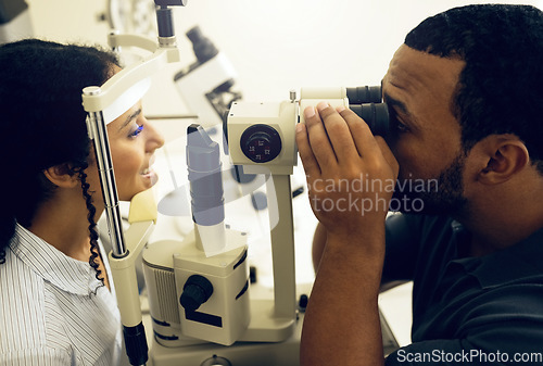 Image of Eye test, machine and a woman with a doctor for a service, vision problem and surgery on lens. Happy, clinic and a patient with a man or optometrist for a medical exam, retina health and check