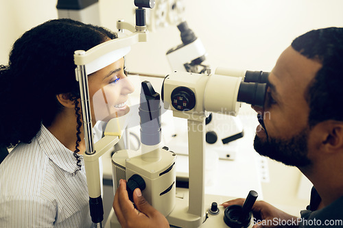 Image of Eye test, machine and a woman with a doctor for optometry, vision problem and surgery on lens. Happy, clinic and a patient with a man or optometrist for a medical exam, retina health and check