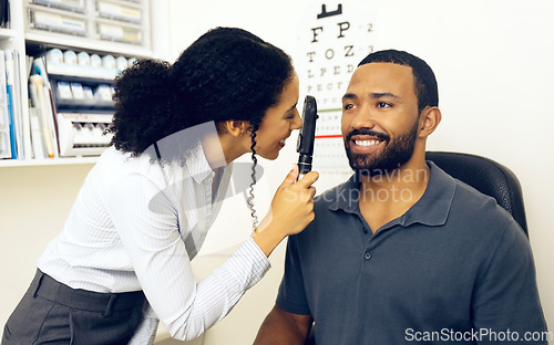 Image of Patient, eye care and healthcare in clinic with ophthalmoscope to check for glaucoma, ocular services and assessment. Optician, woman and retina analysis for eyesight of happy man with expert tools