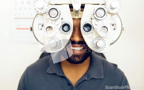 Image of Eye test, face or happy man consulting to help eyesight at optometrist for a optical assessment. Optometry, wellness or customer in clinic for vision, iris or retina health with machine or phoropter