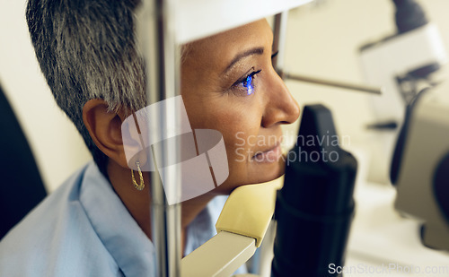 Image of Eye test, machine and a woman for optometry help, scanning retina or optical surgery at a clinic. Healthcare, ophthalmology and a patient or person with an exam for vision, glasses or lens check